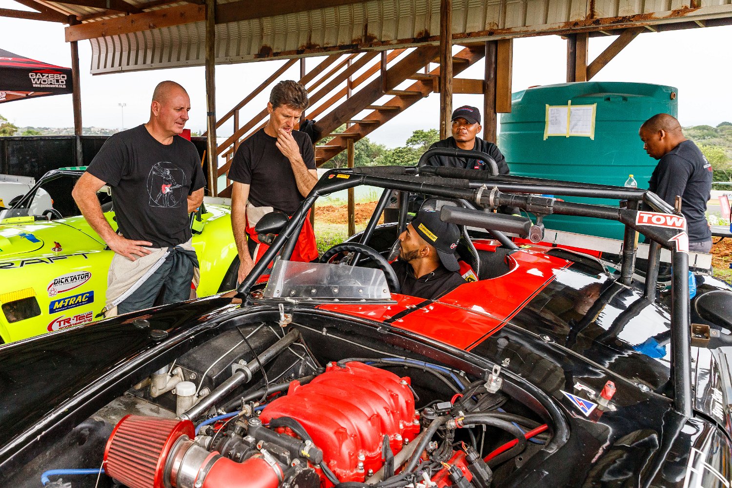 Backdraft Racing team preparing cars in the paddock